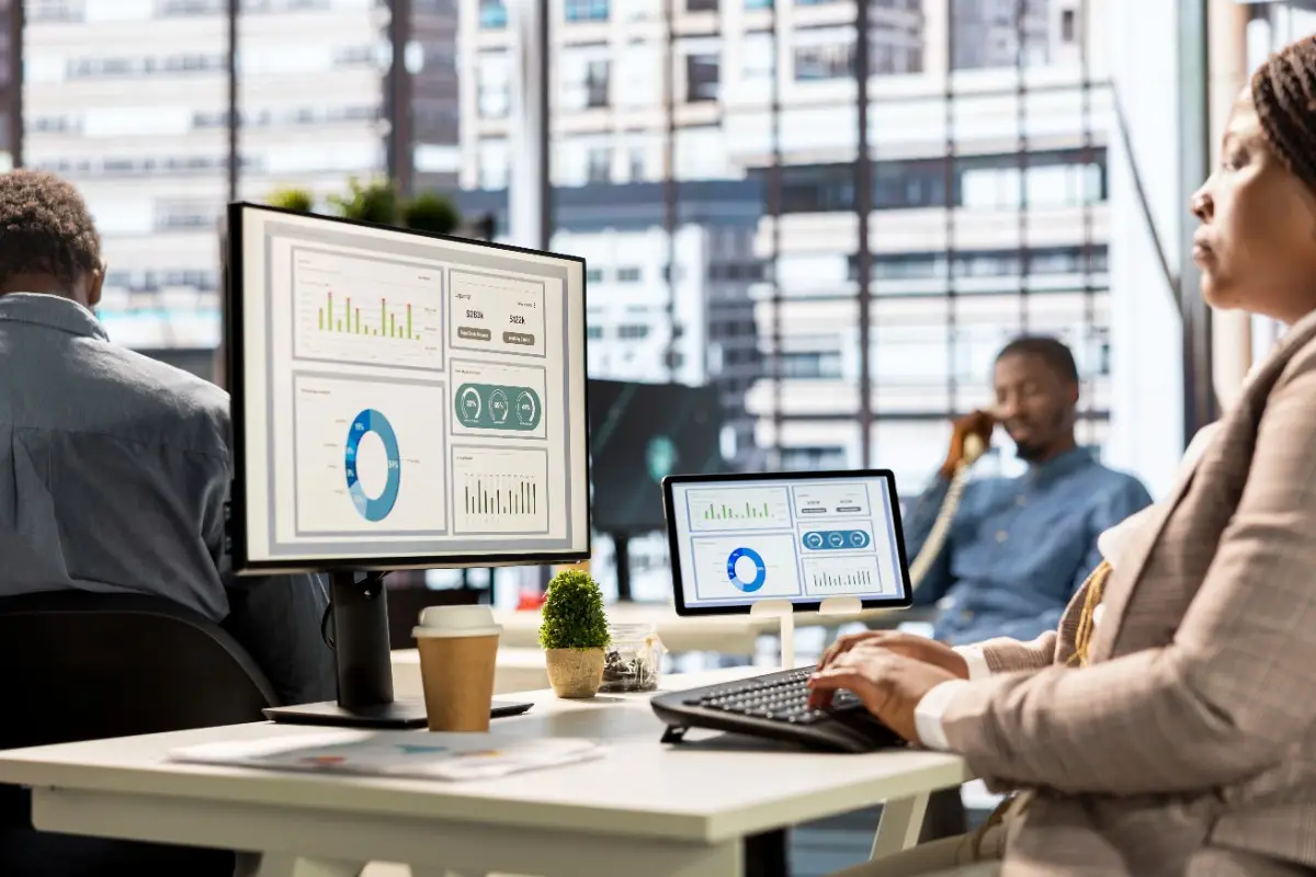 Professional team using ERP software for business automation and data analysis in Abu Dhabi, UAE